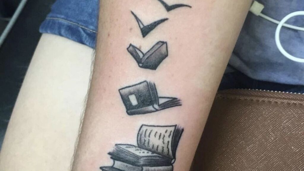 flying books tattoo
