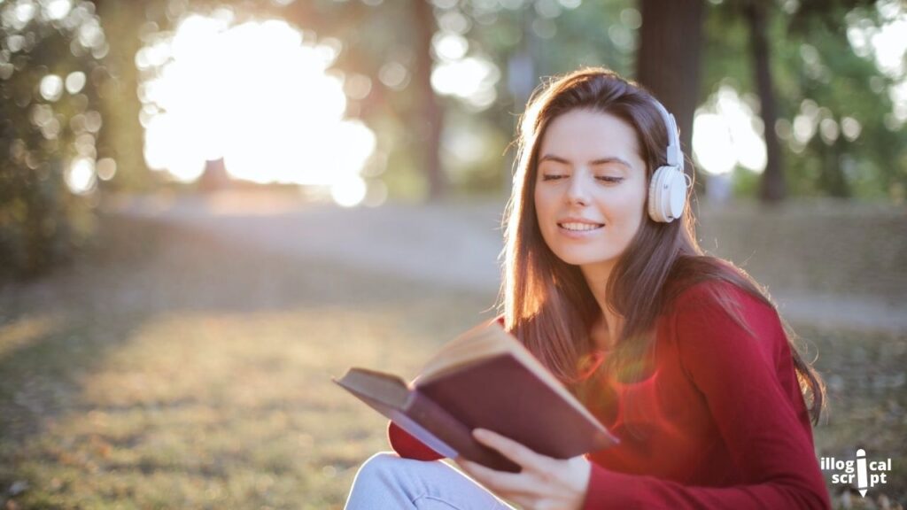 a girl reading relaxingly with headphones on