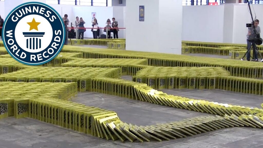 large number of books aligned in domino fashion