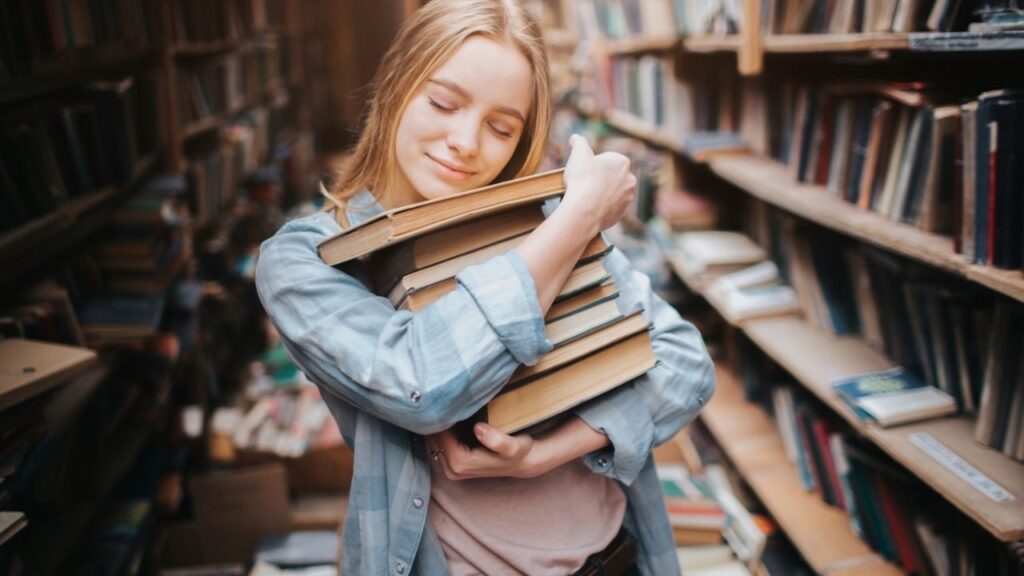 a girl hugging her books