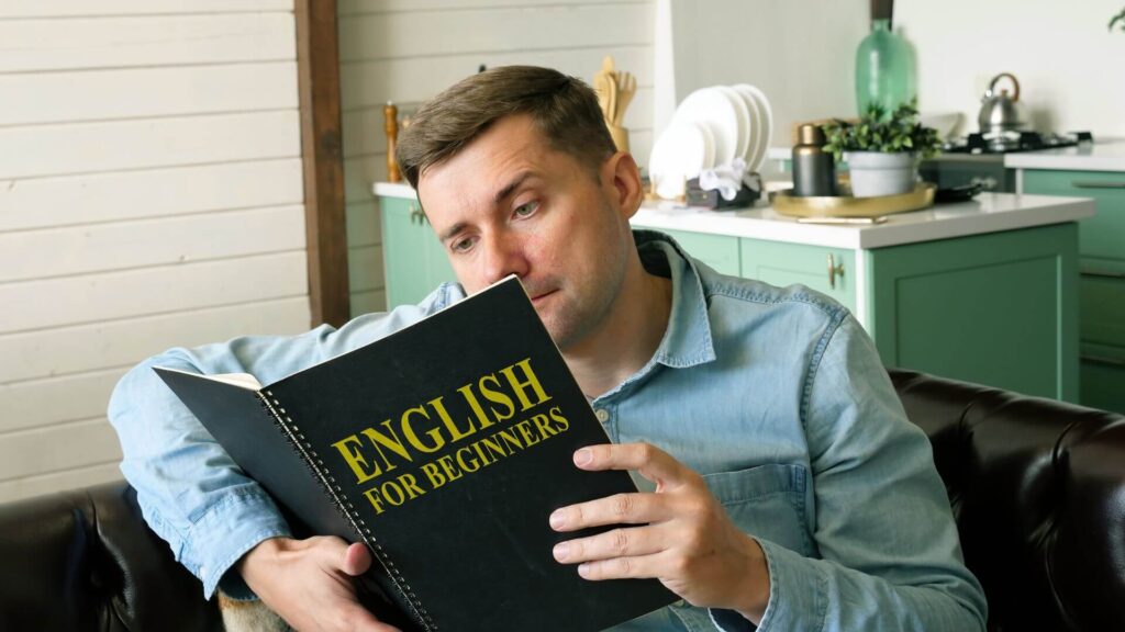 A man reading english for beginners. | 25 Best Novels for Beginners to Improve English