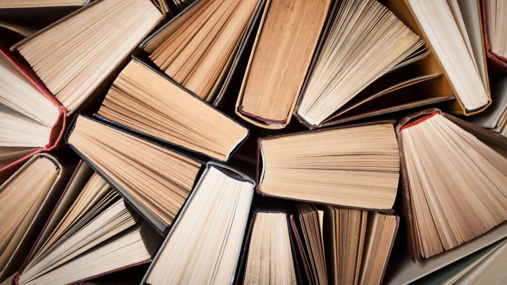 a image of thick books. | How to retain what you read