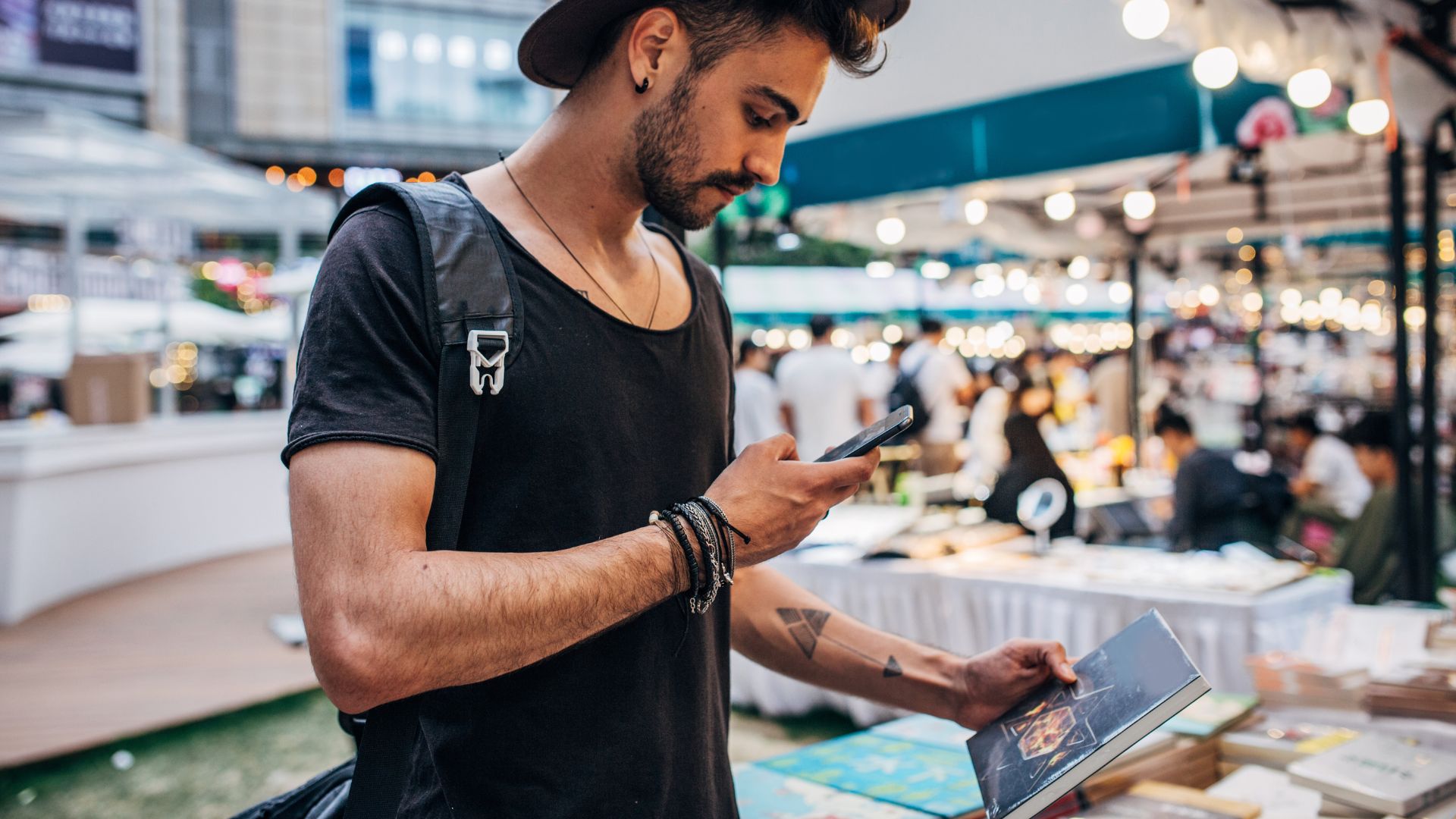 A man is Taking Picture of a Book | Best Book Festivals to Look Out For in 2023 Feature Image